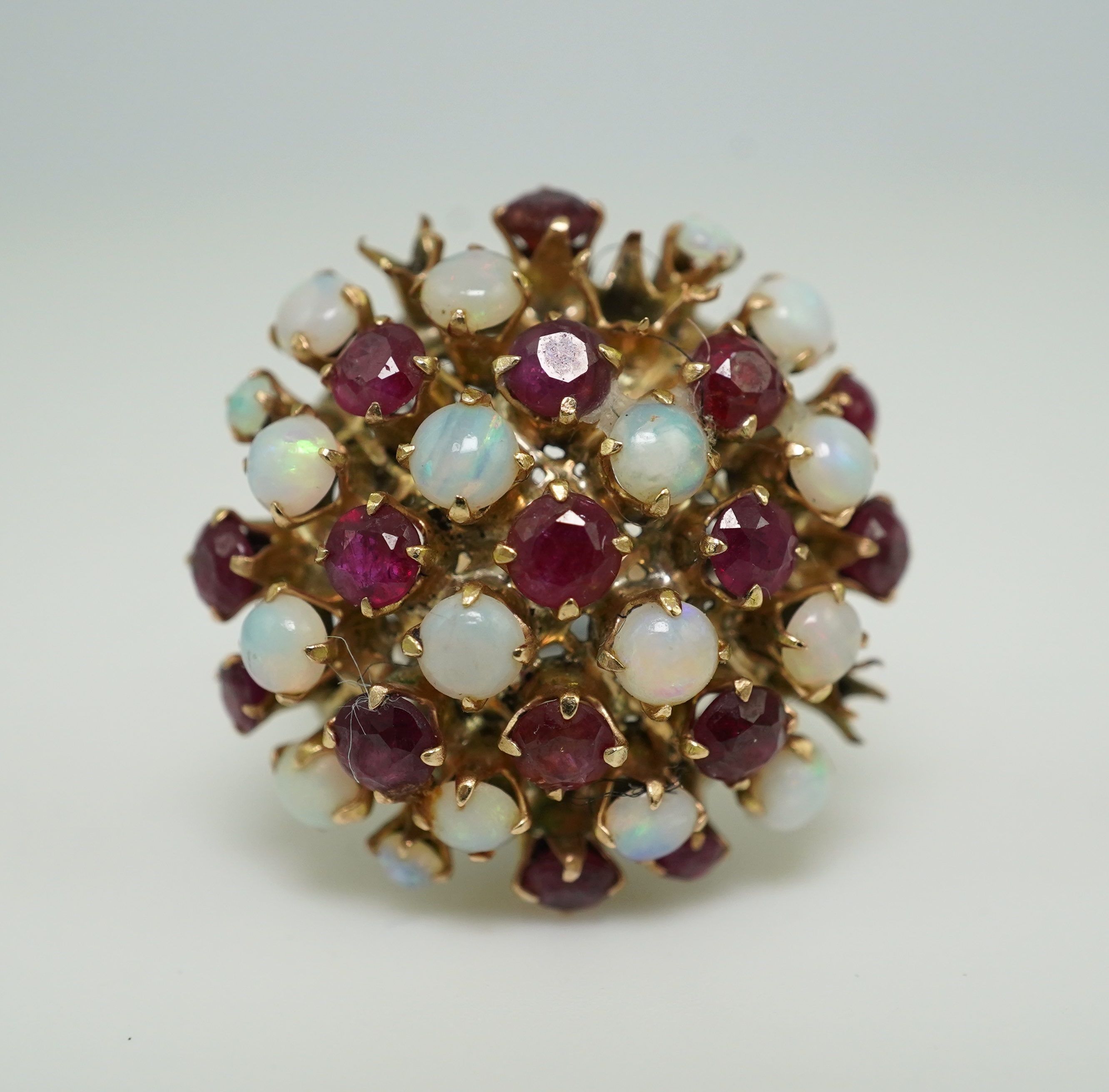 A ruby and opal cocktail ring, mid 20th century